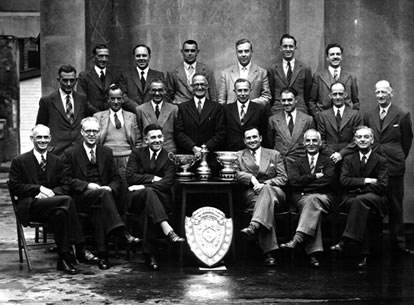 A group involved in the Civil Service Championships, Slade sitting to the right of the trophy table. A group involved in the Civil Service Championships, Slade sitting to the right of the trophy table.